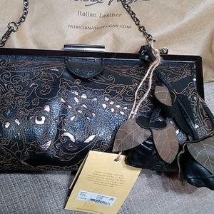 Patricia Nash black and bronze laser cut shoulder bag/clutch. NWT. Dust cover